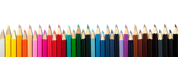 Colored pencils stacked in row on transparent white background. Panorama.