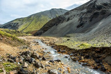 Scenic view of a mountain range with a creek in the foreground. Landmannalaugar, Iceland.