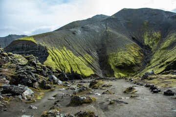 Scenic landscape featuring a rocky valley and a mountain range. Landmannalaugar, Iceland.