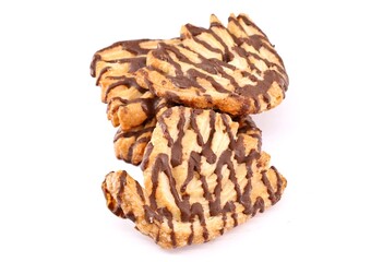 Puff pastries decorated with cocoa cream on white background.