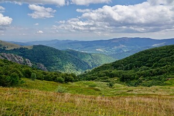 Picturesque mountain landscape featuring lush valleys and rolling hills