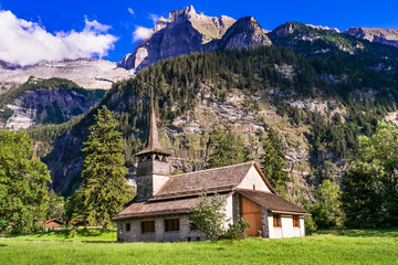 Fototapeta na wymiar Switzerland scenic places. picturesque Kanderseg village , view of old church surrouded by impressive Alps mountains. Canton of Bern