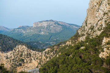 Fototapeta na wymiar Hiking holidays Mallorca, Spain. Beautiful picture with landscape of Serra de Tramuntana mountains in the island of Majorca in Mediterranean sea. Paradise for bikers. Adventure travel.