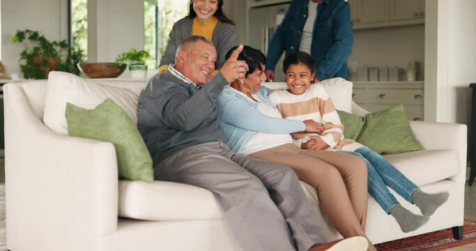 Grandparents, parents or child watching tv in home living room for bonding together on holiday. Happy family, grandmother or dad smiling to enjoy time with mom, girl or grandpa for a movie or film