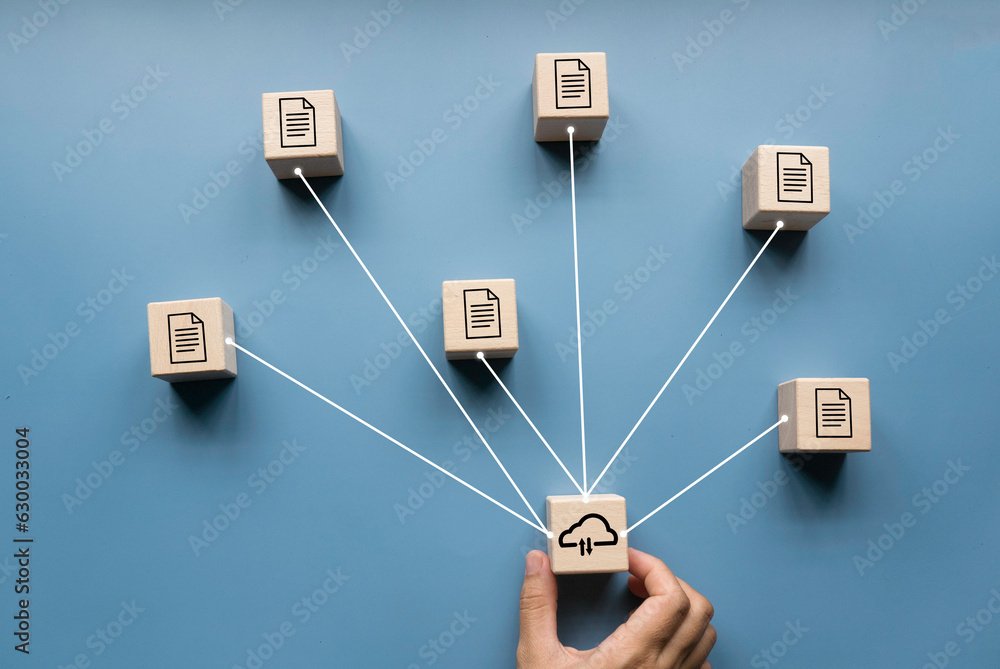 Wall mural Concept of internet cloud technology, digital data and information transfer. File sharing and document transfer. Document or data icon with cloud computing symbol on wooden cube.