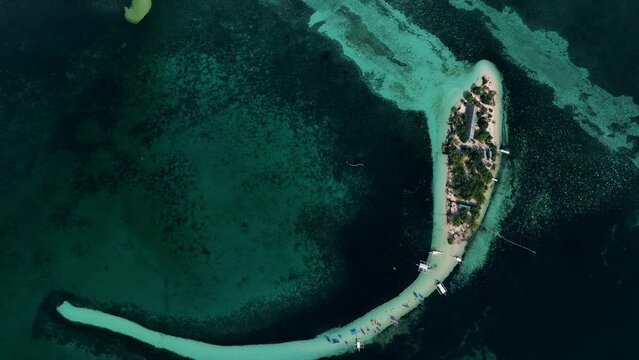 Aerial view of Virgin Island with sailing boats moored along the Atoll sand bars, Bohol Island, Panglao, Philippines.