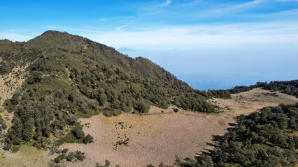 The beautiful Landscape view from Lawu Mountain at sunrise located in Magetan. One of the most beautiful mountains in Java with an altitude of 3265m above sea level. 