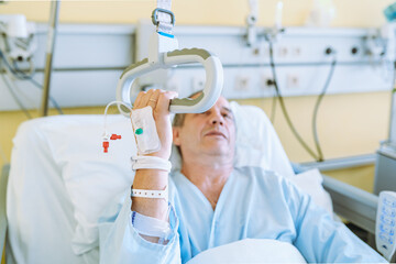 Male patient after injury or surgery in hospital ward