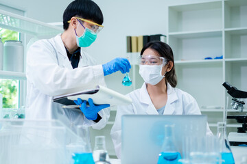 Scientists are working and brainstorming in laboratory. Concept of chemistry, biotechnology, analysis and innovation laboratory. Team work of researchers. Experiment of substances and medicine.