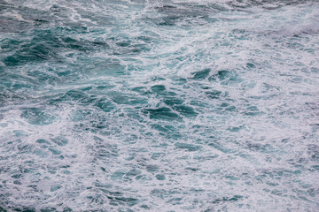 Teal Ocean waves with white foam