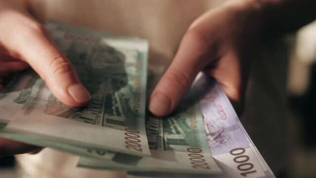 Man Counting Armenian Money Close up, Armenia dram amd banknotes, Tourist Exchgange Money in Bank of the Republic in Yerevan.