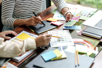 Architects designer team working with color palette chart. © mojo_cp