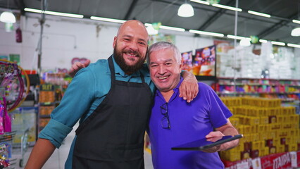 Two employees of Grocery store posing for camera, Brazilian workforce of supermarket, senior manager with staff