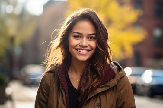 Portrait of a Beautiful Hispanic Woman in front of a Autumn City Background in the Fall