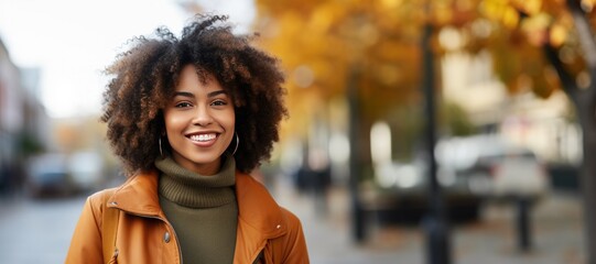 Portrait of a Beautiful Black Woman in front of a Autumn City Background in the Fall - obrazy, fototapety, plakaty