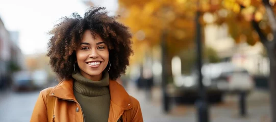 Foto op Canvas Portrait of a Beautiful Black Woman in front of a Autumn City Background in the Fall © JJAVA
