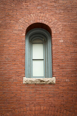 Fototapeta na wymiar Old brick building arch window, Boston, Massachusetts, USA
