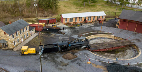 An Drone View of a Narrow Gauge Steam Locomotive Getting off a Turntable and Steaming Up for the...