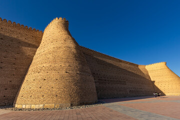 Fototapeta na wymiar Ancient monument archaeological heritage Ark citadel with brick walls and towers, Bukhara, Uzbekistan