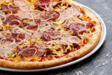 tasty pizza on the dark background