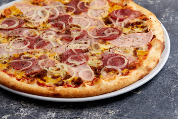 tasty pizza on the dark background