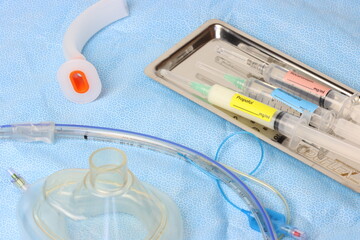 Surgical surface close up view of a endotracheal tube, oxygen mask, Oropharyngeal airway and tray...
