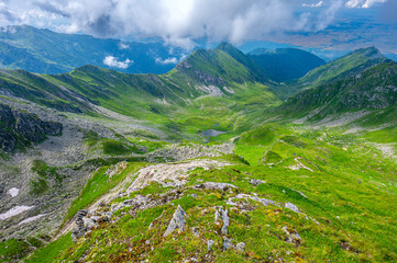 Fototapeta na wymiar Landscape of the Fagaras Mountains. A view from the trail from Balea Lake to Mount Paltinul.