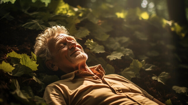 Low angle shot, an elderly man lying on his back on the forest floor, eyes open, marveling at the canopy overhead, bright sunburst filtering through the leaves - Powered by Adobe