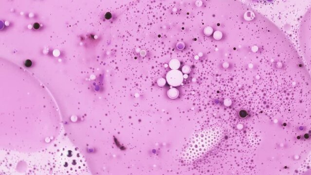 Fantastic Abstract Pink Purple Liquid With Small Beautiful Acrylic Bubbles And Oil Drops Floating On The Surface 