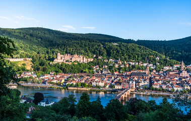 View of German city Heidelberg with castle and old city on a sunny summer evening