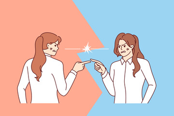 Angry women argue and point fingers at each other, blaming colleague for making mistake at work. Aggressive female rivals with angry facial expressions are in conflict vying out relationships