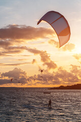 professional kite surfing on ocean or sea sunset, kitesurfing training at water
