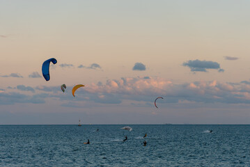 professional kite surfing on ocean or sea sunset, kitesurfing training at water