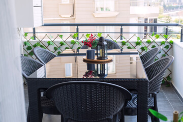 Outdoor Table with glass top and chairs set made of black rattan