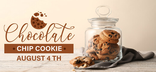 Glass jar with tasty homemade cookies on table