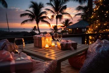 Poster Christmas romantic dinner with gifts on a tropical beach background.  © nnattalli