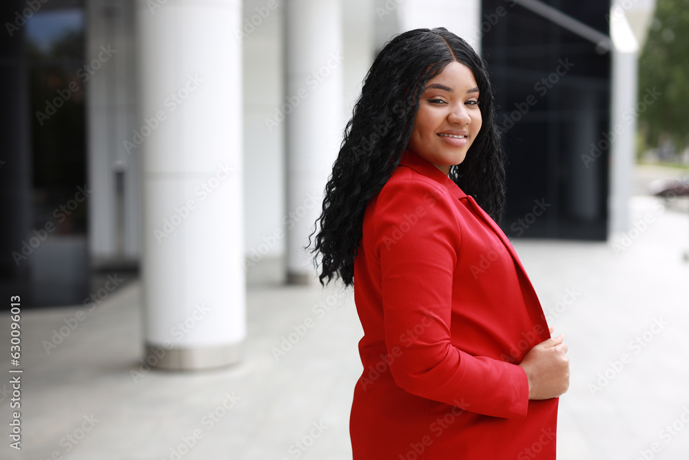 Poster portrait of beautiful african young woman in red jacket