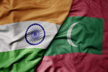 big waving realistic national colorful flag of india and national flag of maldives . - obrazy, fototapety, plakaty