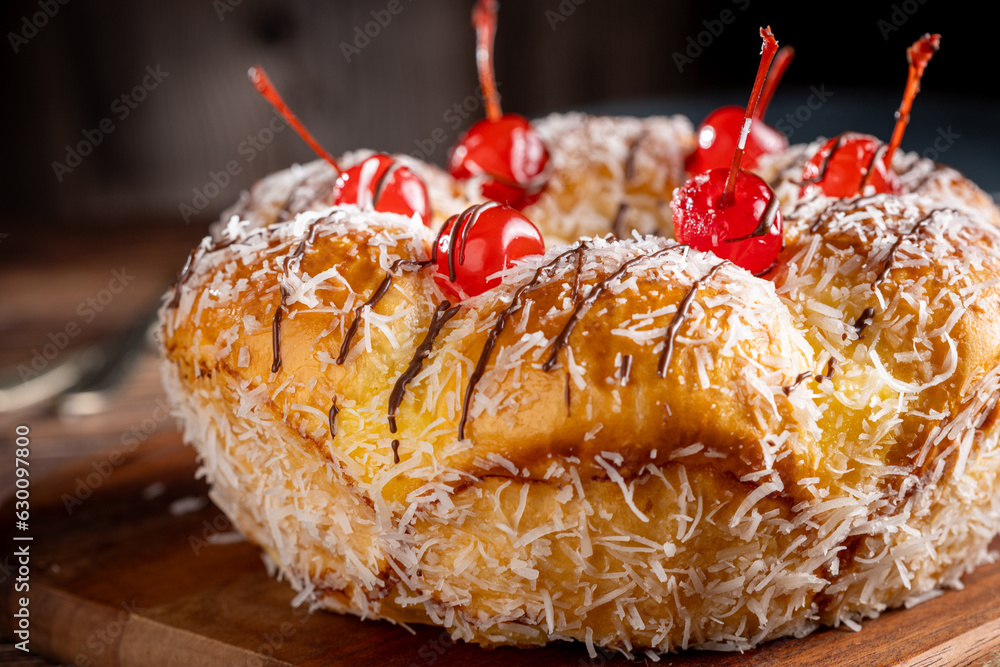 Wall mural sweet bread with pastry cream, coconut and cherry.