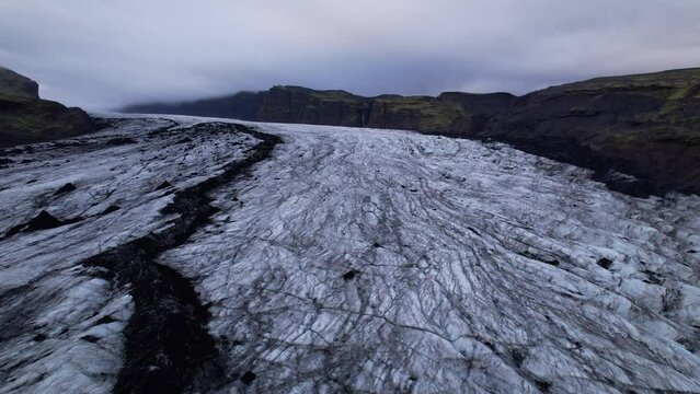 DRONE AERIAL FOOTAGE: Solheimajokull is an outlet glacier of the mighty icecap of Myrdalsjokull on the South Coast of Iceland. It is the fourth-largest ice cap in Iceland.