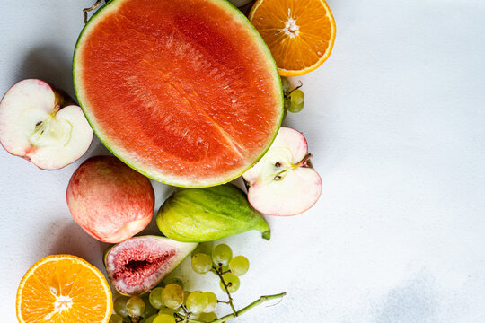 Seasonal fruit frame on white surface
