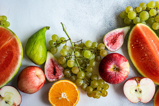 Seasonal fruit frame on white surface