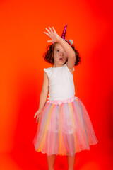Beautiful cheerful girl standing making gestures with her arms.