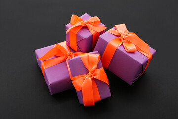 Beautiful gift boxes for Halloween on dark background