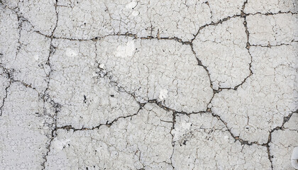 Dirty grunge white painted cracked asphalt texture
