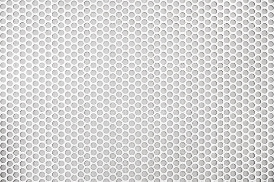 Empty white (light gray) perforated metal grid with circular holes for abstract  horizontal seamless, rounded mesh plate background, steel texture, space patterns for work, modern wallpaper,close up