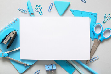 Composition with blank paper sheet and different school stationery on white background, closeup