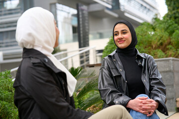 Young muslim friends. Muslim women together