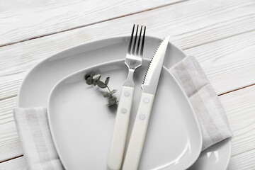 Stylish modern table setting on white wooden background