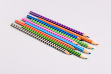 Set of color pencils on light background